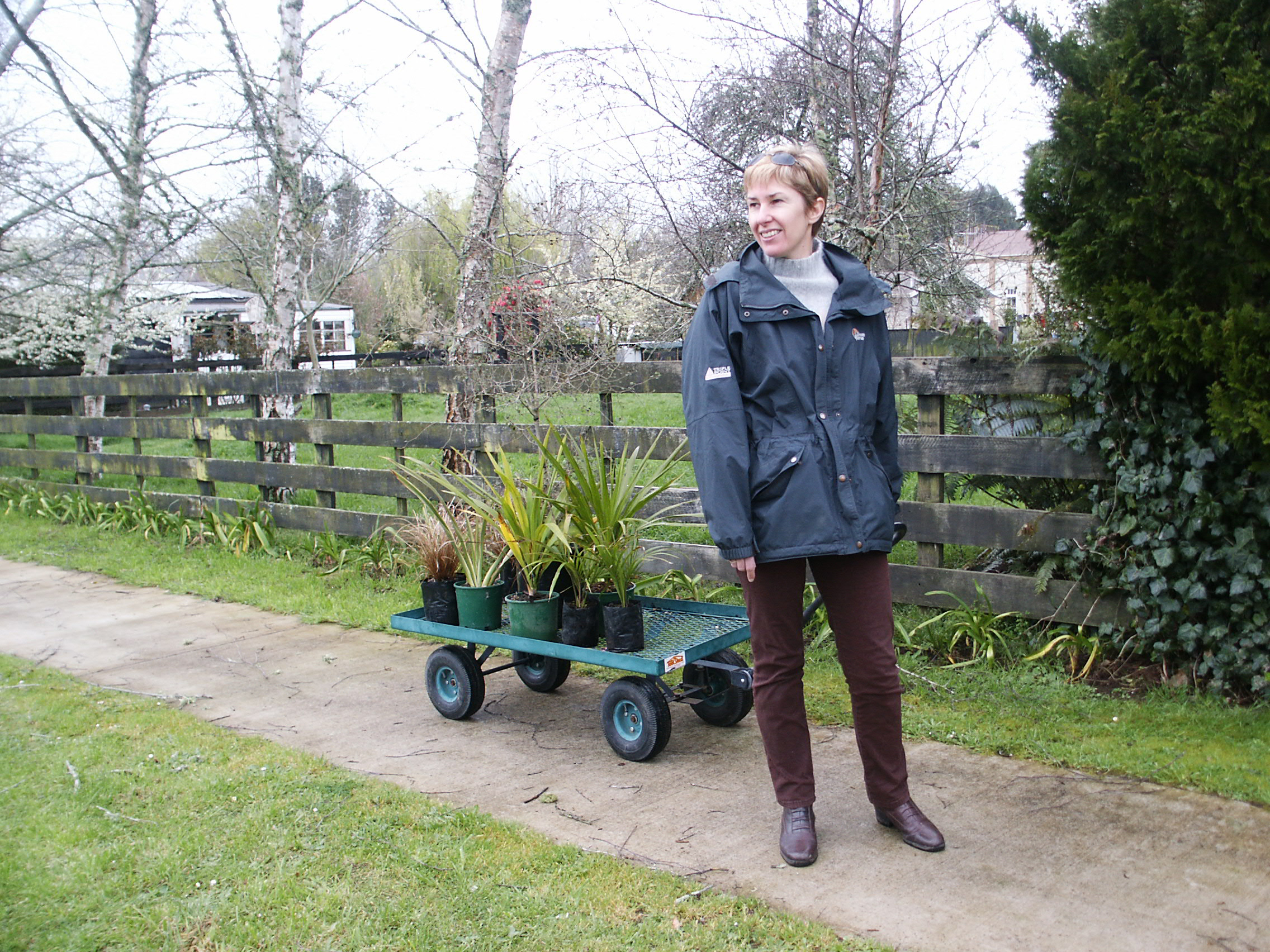 Jen with a local purchase for the garden. Essentially we built are garden one plant at a time and I held our budget in check by dividing plants as they grew.