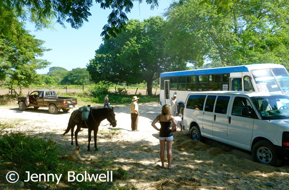 A bus which was quite a surprie to see squeezes by as I continue to work clearing sand from around the rear wheel whilst the rest of Mexico discusses what to do after I have failed to improve the situation.