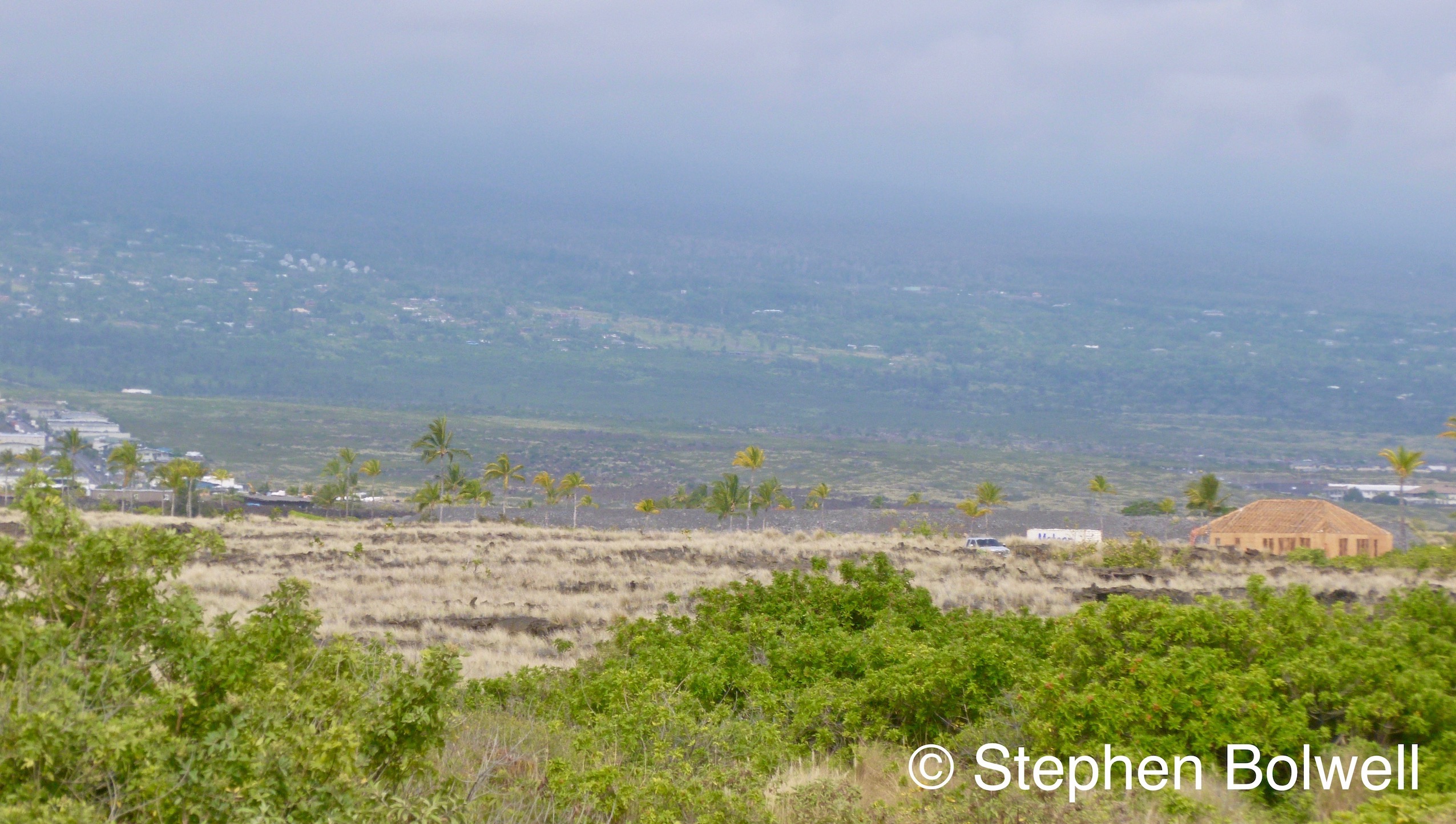 On the eastern side of the island, looking into the hills from sea level, air pollution would build on days when the volcano was especially active over on the opposite side.